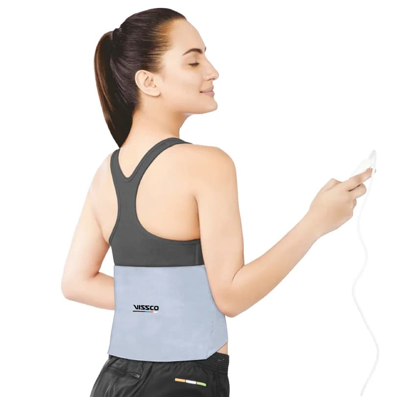 Heating belt worn around the lower back, with its controller held in one hand